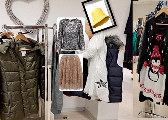 Ein Garderobenständer mit Kleidungsstücken ist auf dem Foto zu sehen.