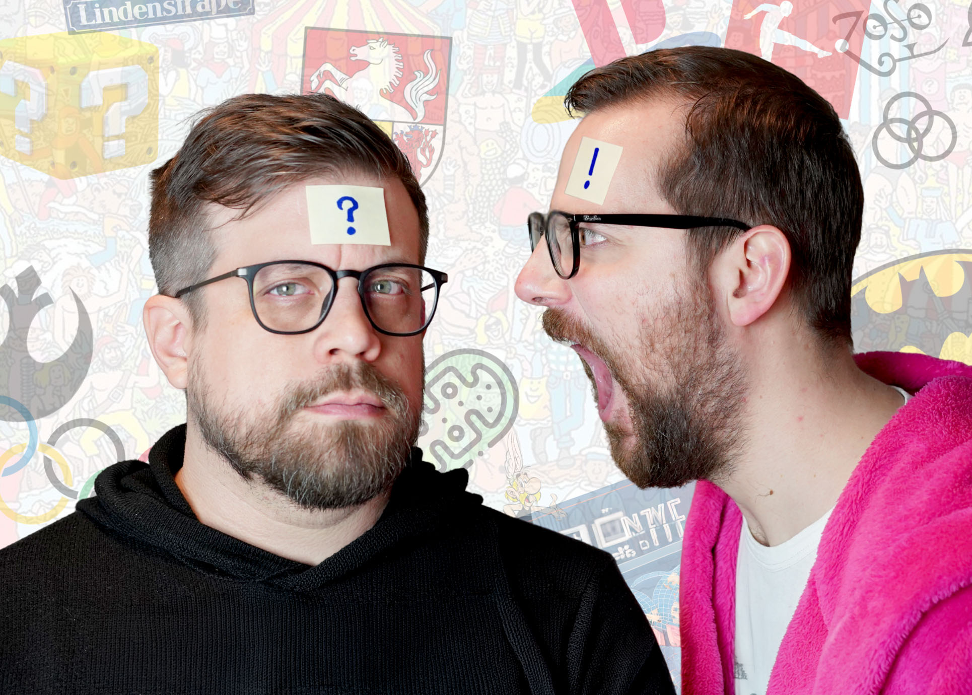 Jan Schmidt und Baumunk haben - passend zum Quiz - einen weissen Zettel mit einem Ausrufezeichen und einem Fragezeichen auf der Stirn.
